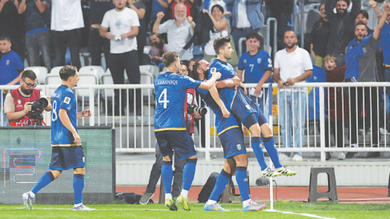 PRISTINA (Kosovo): Elvis Rexhbecaj (R) of Kosovo celebrates with team-mates after scoring against Sweden during their Group &lsquo;B&rsquo; match at the Fadil Vokrri Stadium.&mdash;Reuters
