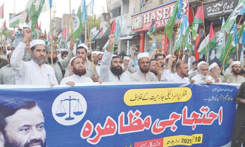 Workers of Jamaat-i-Islami chant slogans during a protest in Peshawar. — White Star Workers of Jamaat-i-Islami chant slogans during a protest in Peshawar. — White Star