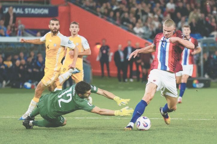 OSLO: Norway’s Erling Haaland (R) shoots to score during the match against Moldova at Ullevaal Stadion.—Reuters