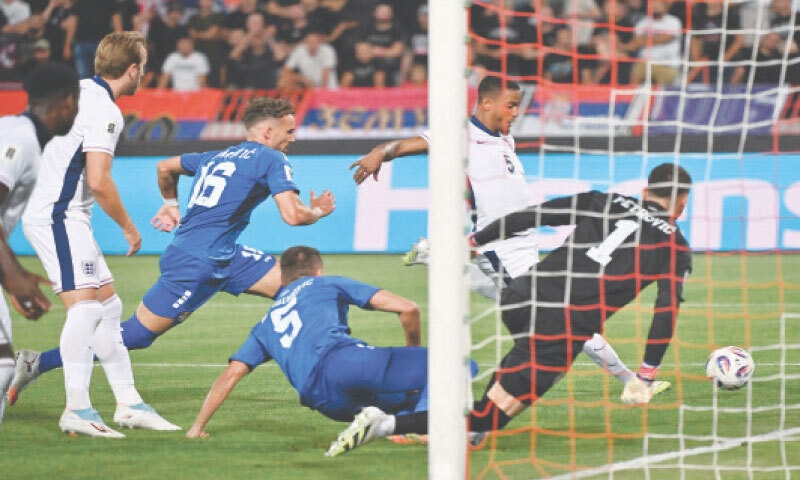 BELGRADE: England’s Ezri Konsa (second R) scores during the World Cup qualifiers against Serbia at the Rajko Mitic Stadium.—AFP BELGRADE: England’s Ezri Konsa (second R) scores during the World Cup qualifiers against Serbia at the Rajko Mitic Stadium.—AFP
