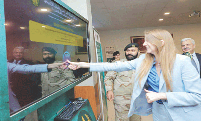 British High Commissioner Jane Marriott touches a digital screen to inaugurate the Digital Case Management System  at ANF Headquarters in Rawalpindi on Thursday. &mdash; White Star