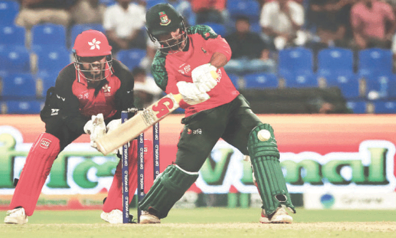 BANGLADESH batter Towhid Hridoy plays a shot as Hong Kong wicket-keeper Zeeshan Ali looks on during the Asia Cup Twenty20 International at the Sheikh Zayed Cricket Stadium on Thursday.&mdash;AFP