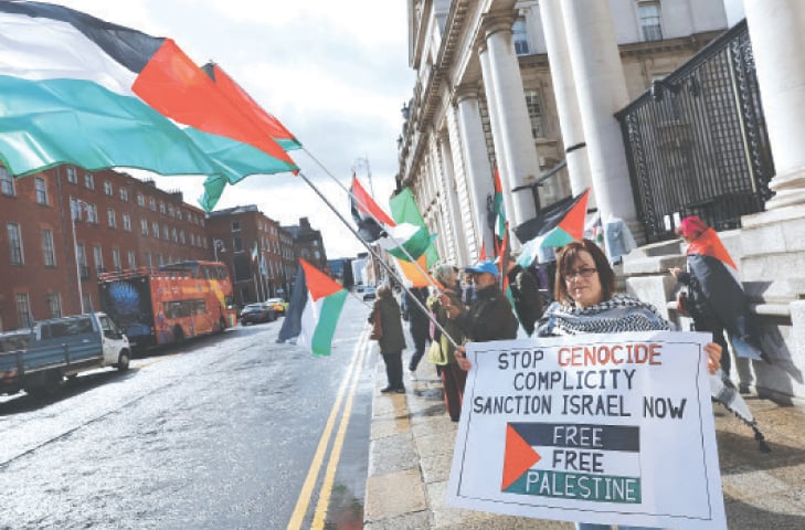 PRO-PALESTINIAN supporters hold a demonstration outside the Prime Minister&rsquo;s office in Dublin.&mdash;Reuters