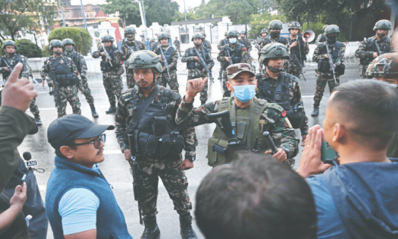 SOLDIERS take their positions in front of the President House during a curfew in Kathmandu.&mdash;AFP