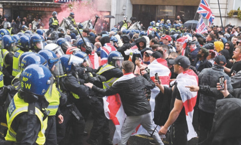 POLICE clash with supporters of British anti-immigration activist Stephen Yaxley-Lennon during the rally.—Reuters POLICE clash with supporters of British anti-immigration activist Stephen Yaxley-Lennon during the rally.—Reuters