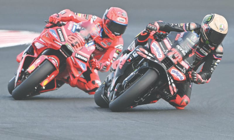Aprilia Racing&rsquo;s Marco Bezzecchi (R) and Ducati Lenovo Team&rsquo;s Marc Marquez fight for the lead during sprint race of the San Marino MotoGP at the Misano World Circuit Marco Simoncelli on Saturday.&mdash;AFP