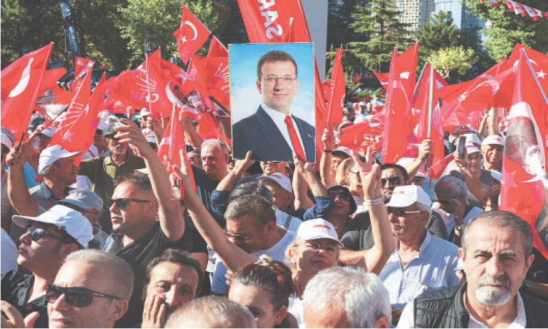 Ankara: A supporter of main opposition Republican People&rsquo;s Party (CHP) holds a portrait of jailed Istanbul Mayor Ekrem Imamoglu during a rally on Sunday.&mdash;Reuters