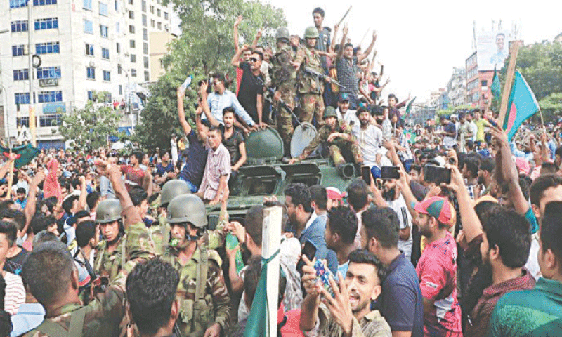 Bangladesh army personnel mingle with people in Dhaka during the 2024 monsoon revolution.—Courtesy The Daily Star Bangladesh army personnel mingle with people in Dhaka during the 2024 monsoon revolution.—Courtesy The Daily Star