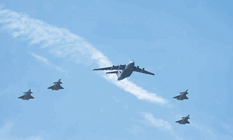 A Chinese People&rsquo;s Liberation Army (PLA) Air Force Y-20 transport aircraft carrying the remains of Chinese People&rsquo;s Volunteers (CPV) martyrs, escorted by four J-20 fighter jets, is pictured in Shenyang, the capital of Liaoning province.&mdash;Courtesy China Daily