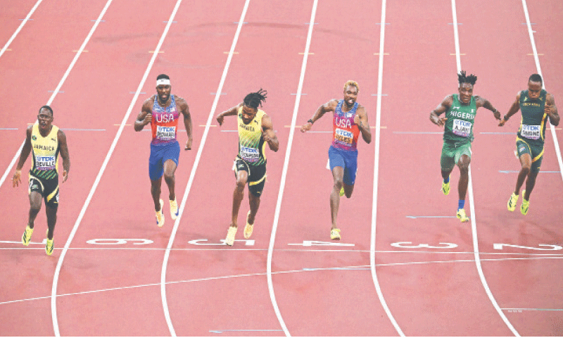 JAMAICA’S Oblique Seville (L) crosses the line to win the 100m final ahead of second placed compatriot Kishane Thompson (third L), third placed Noah Lyles (third R) and fourth placed Kenneth Bednarek (second L) of the US during the World Athletics Championships at the Japan National Stadium on Sunday.—Reuters