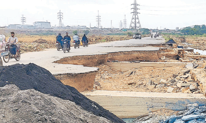 A major portion of Baba Walayat Road in Shah Faisal Town is washed away after floodwaters from the nearby Malir river submerged it for days following heavy rains. Officials said the city authorities will start rehabilitation work on Wednesday.&mdash;INP