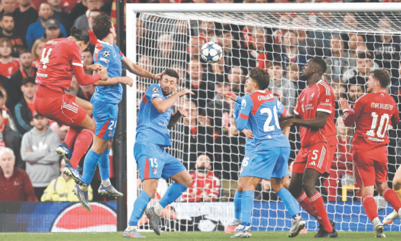 LIVERPOOL: Liverpool&rsquo;s Virgil van Dijk (L) heads to score the winner against Atletico Madrid during their Champions League match 
at Anfield.&mdash;AFP