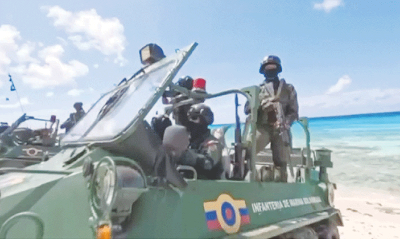 Soldiers on military vehicles guard a beach during drills in La Orchila, Venezuela,  amid escalating tensions with the US.&mdash;Reuters
