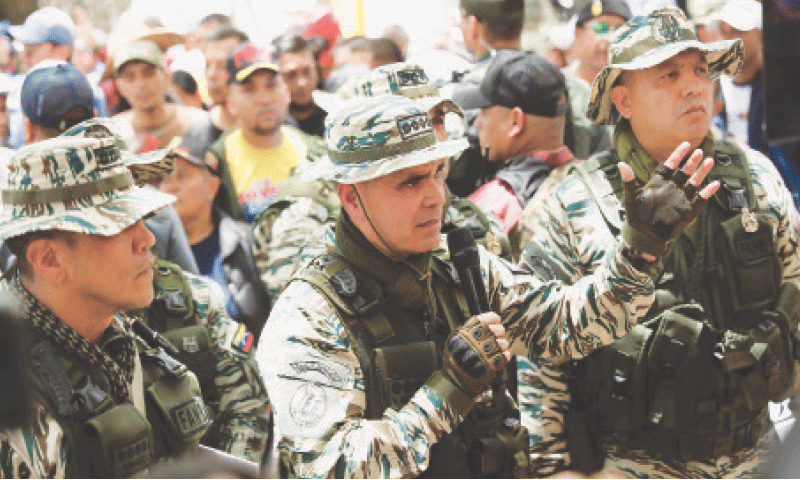 CARACAS: Venezuela’s defence minister attends a drill to train citizens in weapons handling amid tensions with the US.—Reuters CARACAS: Venezuela’s defence minister attends a drill to train citizens in weapons handling amid tensions with the US.—Reuters