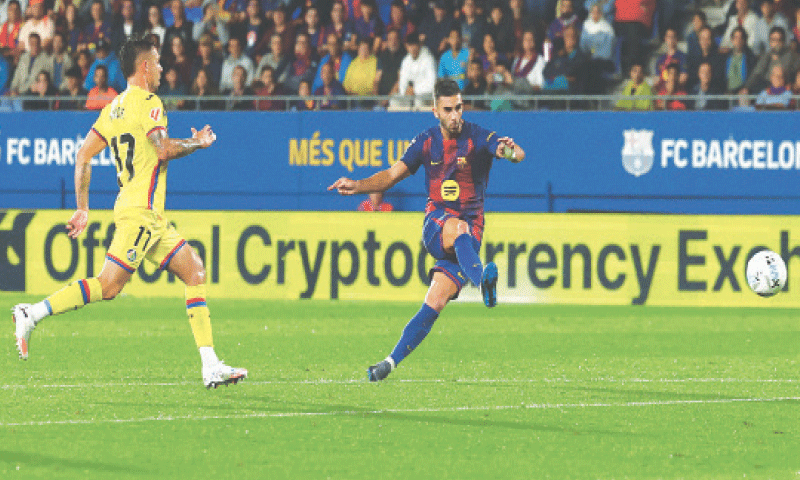 BARCELONA: Ferran Torres of Barcelona shoots to score against Getafe during their La Liga match at the Johan Cruyff Stadium.&mdash;Reuters