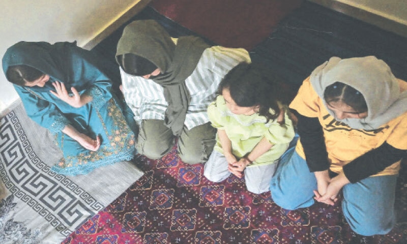 Afghan refugees Shayma, Zahra and Laylama speak to journalists at their residence in Islamabad.&mdash;AFP