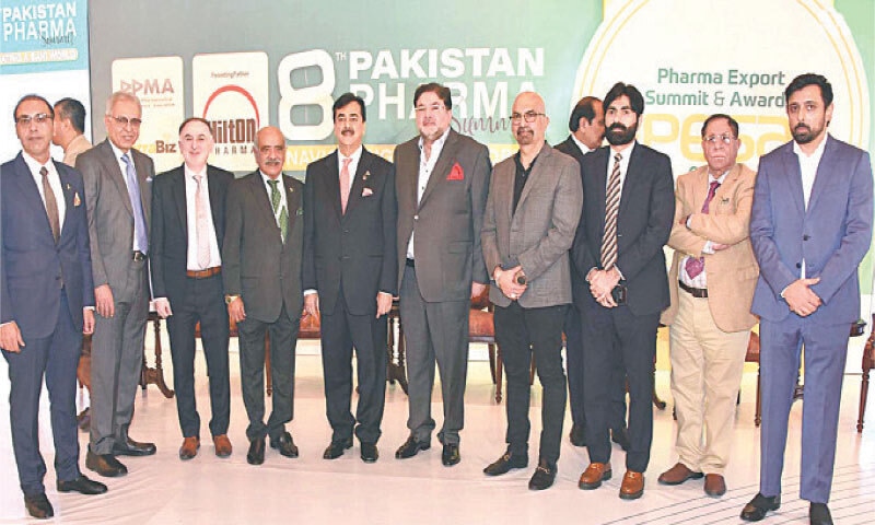 Senate Chairman Syed Yousaf Raza Gilani poses for a photograph with participants of the 8th Pharma Summit in Islamabad on Wednesday. — APP