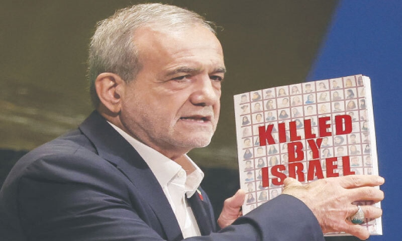 IRAN&rsquo;s President Masoud Pezeshkian holds a book as he addresses the UN General Assembly.&mdash;Reuters