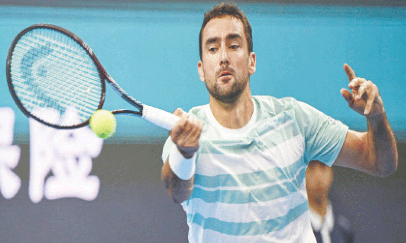 CROATIA&rsquo;S Marin Cilic hits a return against Jannik Sinner of Italy during their China Open round-of-32 match on Thursday.&mdash;AFP