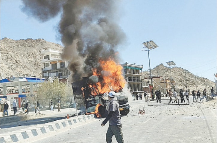 A VEHICLE is set on fire during a protest demanding statehood for Ladakh and job quotas for locals.—Reuters