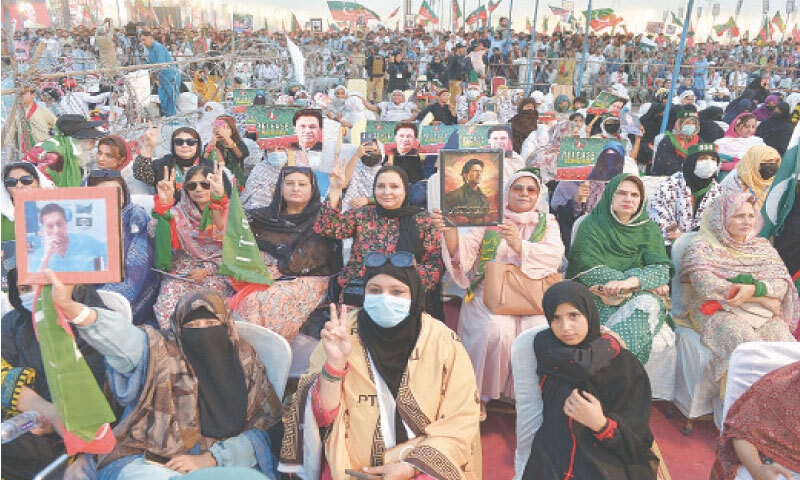 Workers of Pakistan Tehreek-i-Insaf attend a public meeting on Ring Road in Peshawar on Saturday. &mdash; Photo by Shahbaz Butt