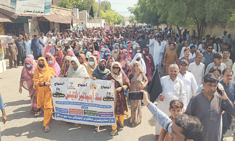 PROTESTING Sindh government employees march through a street in Mithi.—Dawn PROTESTING Sindh government employees march through a street in Mithi.—Dawn