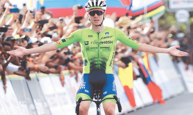 SLOVENIA&rsquo;S Tadej Pogacar celebrates as he crosses the finish line to win the Men&rsquo;s Elite Road Race during the Road World Championships on Sunday.&mdash;Reuters