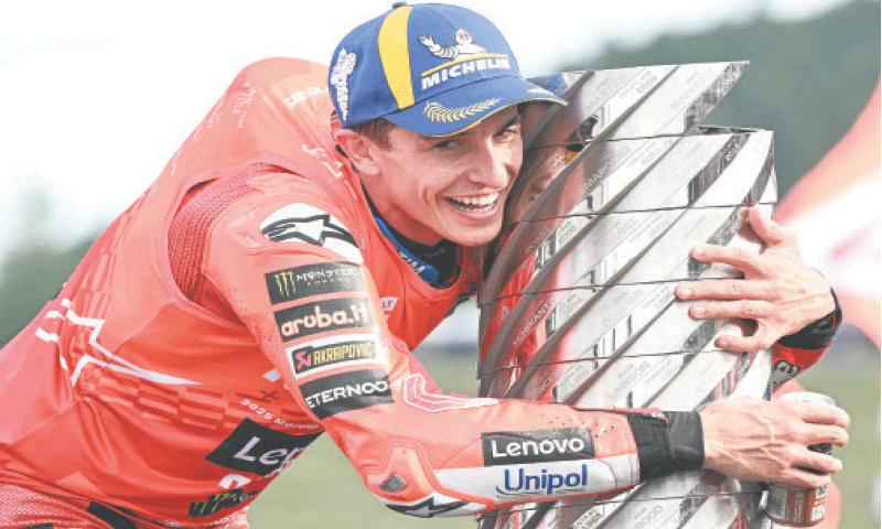 DUCATI Lenovo Team&rsquo;s Spanish rider Marc Marquez celebrates with the trophy after the MotoGP Japanese Grand Prix at the Mobility Resort Motegi on Sunday.&mdash;AFP