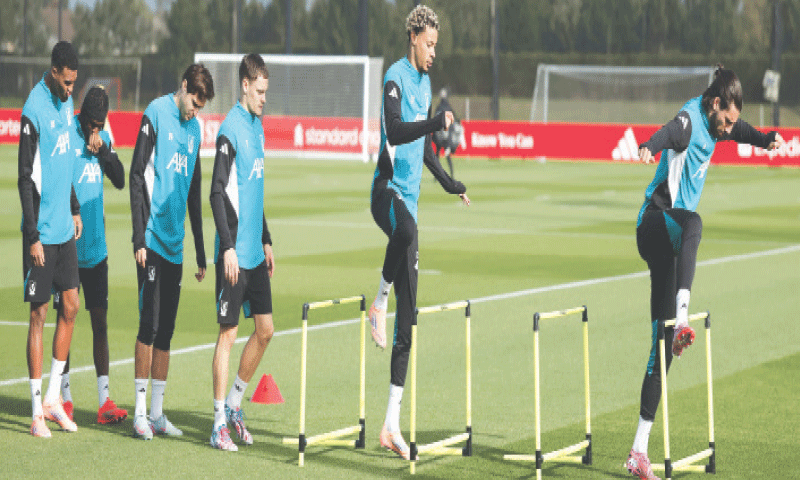 LIVERPOOL: Liverpool players undergo drills during a training session at the AXA Training Centre on Monday.&mdash;Reuters