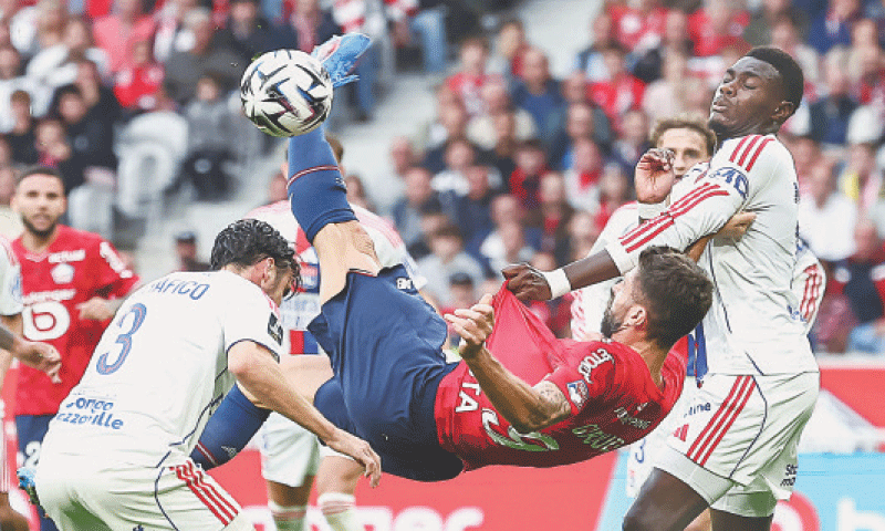 VILLENEUVE D&rsquo;ASCQ: Lille&rsquo;s Olivier Giroud attempts an overhead kick during the Ligue 1 match against Olympique Lyonnais at the Stade Pierre-Mauroy.&mdash;AFP