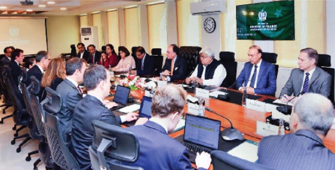  Finance Minister Muhammad Aurangzeb chairs a meeting with the visiting IMF review mission at the Finance Division.—APP 