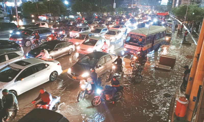 Water accumulated on Sharea Faisal severely hampered the flow of traffic on Tuesday. &mdash;Shakil Adil/ White Star