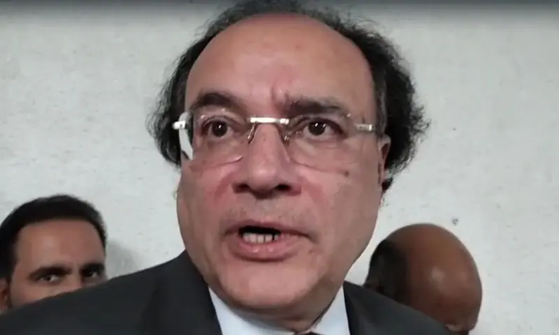 Finance Minister Muhammad Aurangzeb speaks with reporters in Islamabad on October 1. — Tahir Sherani