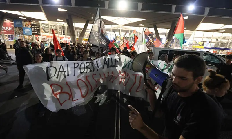Protesters demonstrate against the interception of the Global Sumud Flotilla by Israel on the platforms of Naples Central Station in Naples, Italy on October 01. &mdash; AFP
