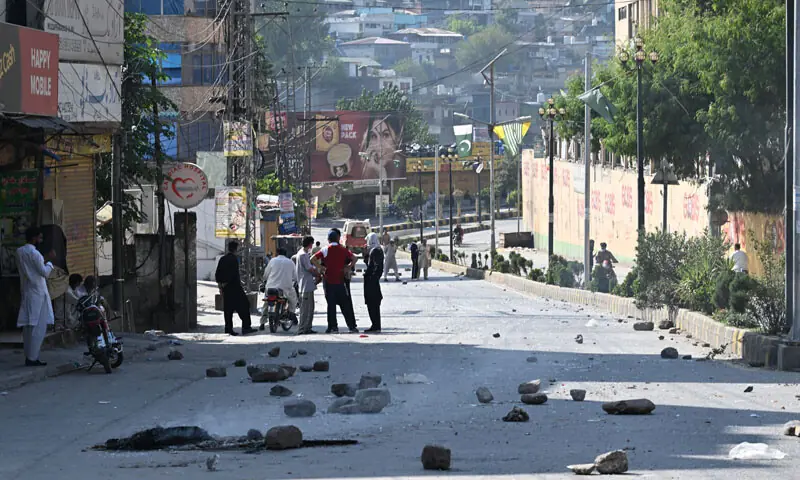 Awami Action Committee activists block a street during a demonstration at a market area in Muzaffarabad, capital of Azad Kashmir on October 1, 2025, demanding structural reforms and political and economic rights. — AFP
