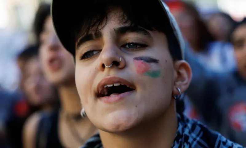 A demonstrator wears face paint of a Palestinian flag, as students march during a student strike to support Palestinians in Gaza and to condemn the Israeli force&rsquo;s interception of the vessels of the Global Sumud Flotilla, in Madrid, Spain, on October 2. &mdash; Reuters