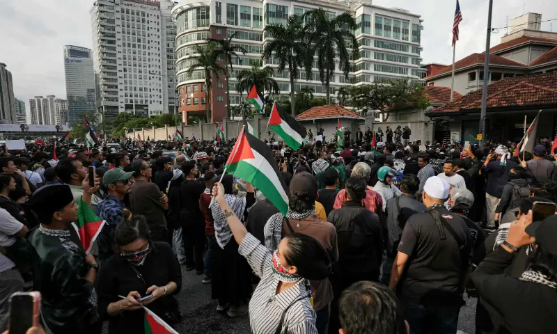 People gather outside the US embassy to protest against Israel&rsquo;s interception of a Gaza-bound aid flotilla and the detention of at least 12 Malaysian activists, in Kuala Lumpur, Malaysia, on October 2. &mdash; AFP