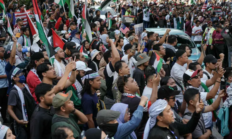 People gather outside the US embassy to protest against Israel&rsquo;s interception of a Gaza-bound aid flotilla and the detention of at least 12 Malaysian activists, in Kuala Lumpur, Malaysia, on October 2. &mdash; AFP