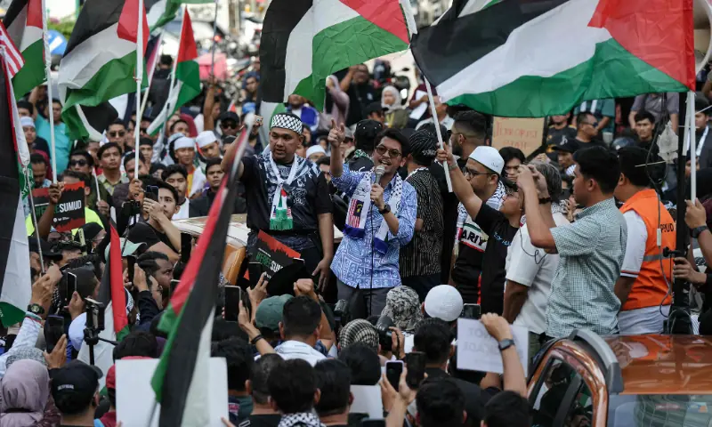 People gather outside the US embassy to protest against Israel&rsquo;s interception of a Gaza-bound aid flotilla and the detention of at least 12 Malaysian activists, in Kuala Lumpur, Malaysia, on October 2. &mdash; AFP