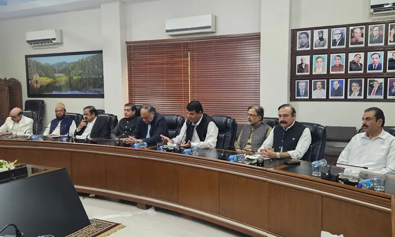 Members of a government delegation hold talks with the Joint Awami Action Committee in Muzaffarabad on Thursday. — Photo courtesy Tariq Fazal Chaudhry Twitter