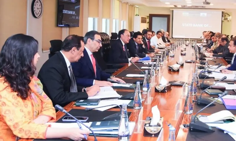 Finance Minister Muhammad Aurangzeb chairs a meeting of the Economic Coordination Committee in Islamabad on October 2. &mdash; PID