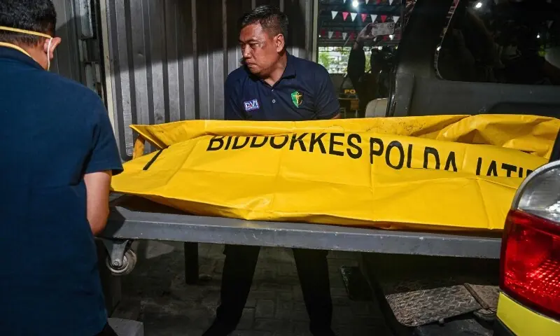 Police officials transfer the remains of a student, killed in a building collapse at the Al Khoziny Islamic boarding school, to a morgue at the Bhayangkara hospital in Surabaya, East Java province, Indonesia on Saturday. &mdash; AFP