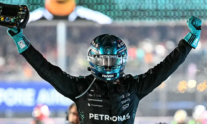 Mercedes’ British driver George Russell celebrates his victory after the Formula One Singapore Grand Prix at the Marina Bay Street Circuit in Singapore on October 5. — AFP Mercedes’ British driver George Russell celebrates his victory after the Formula One Singapore Grand Prix at the Marina Bay Street Circuit in Singapore on October 5. — AFP