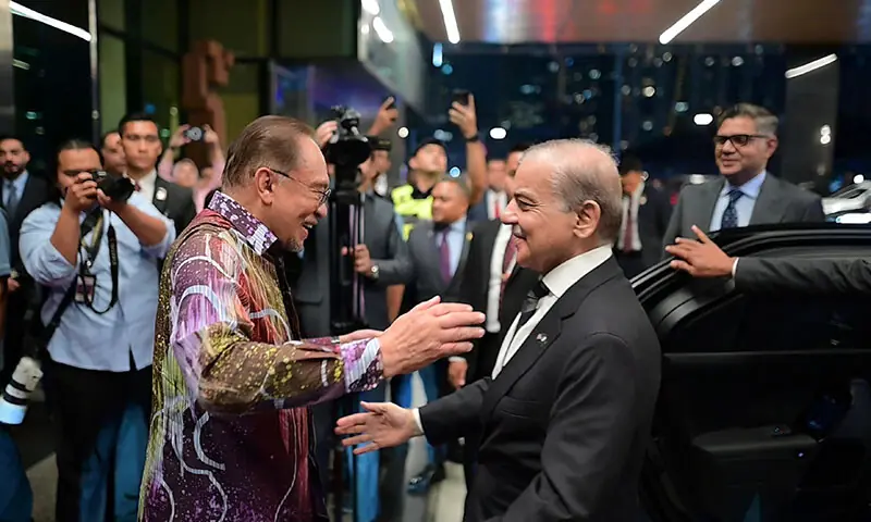 Prime Minister Shehbaz Sharif is received by Malaysian Prime Minister Anwar Ibrahim in Kuala Lumpur, Malaysia on October 5. — X/@PTVNewsOfficial Prime Minister Shehbaz Sharif is received by Malaysian Prime Minister Anwar Ibrahim in Kuala Lumpur, Malaysia on October 5. — X/@PTVNewsOfficial