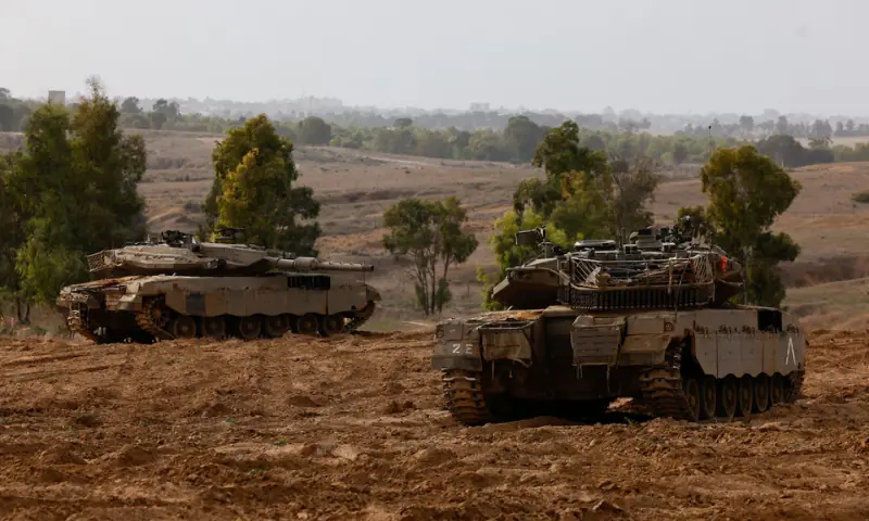 Israeli tanks take position near a border with Gaza, amid the conflict between Israel and Hamas, on November 22, 2023. &mdash; Reuters