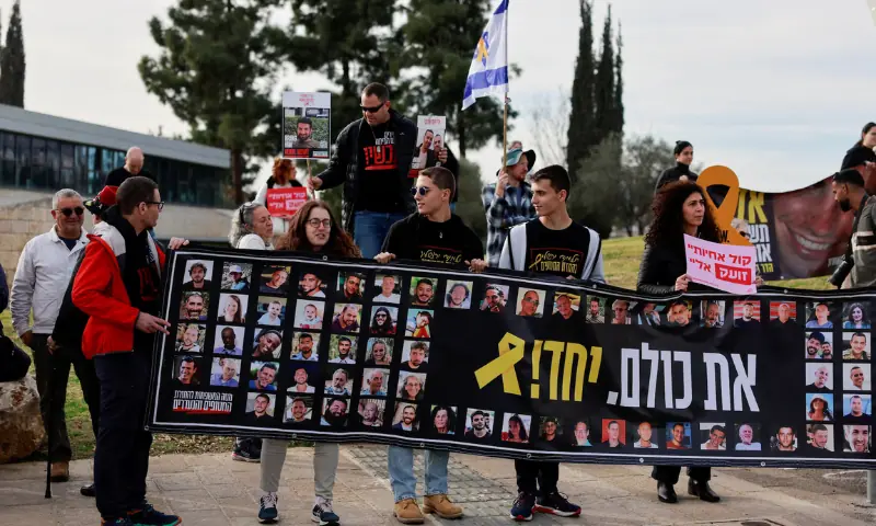 Families and supporters of Israeli hostages kidnapped during the October 7, 2023 attack by Hamas, hold a banner as they gather to demand a deal that will bring back all the hostages held in Gaza, outside a meeting between hostage representatives and Israeli Prime Minister Benjamin Netanyahu, in Jerusalem, on January 14, 2025. &mdash; Reuters/File