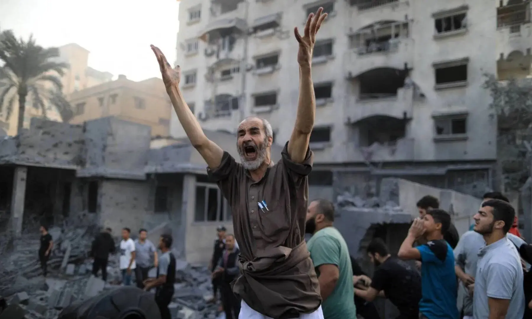  A Palestinian shouts following an Israeli strike, in Khan Younis in the southern Gaza Strip on Oct 14, 2023, as fighting between Israel and the Hamas movement continues for the eighth consecutive day.— AFP 