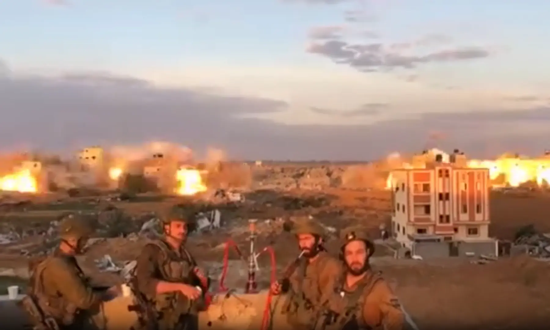 Israeli commandos smoke shisha in Gaza as buildings are destroyed, some day between December 2023 and January 2024. &mdash; screengrab from 8219 Commando members/Facebook via Bellingcat outlet