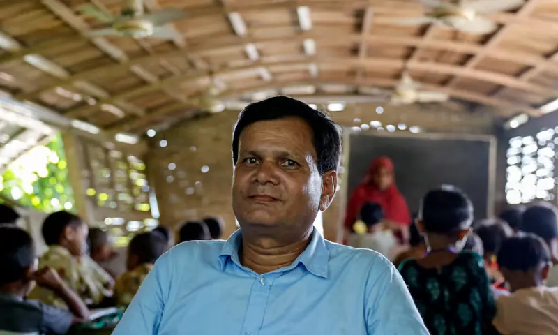 Madhusudan Karmaker, Programme in Charge of the Shidhulai Swanirvar Sangstha, which operates floating school in the flood prone Bhangura area, poses for a picture in Pabna, Bangladesh, on September 25. — Reuters