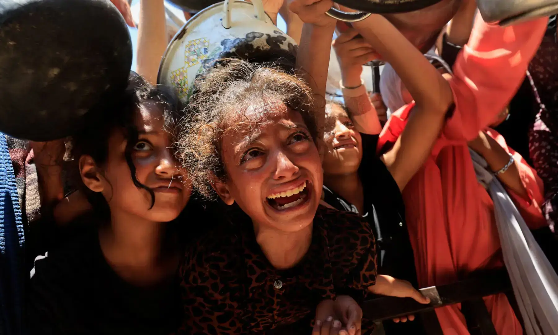 Palestinians wait to receive food from a charity kitchen, amid a hunger crisis, in Khan Younis, southern Gaza Strip, on Aug 4, 2025. &mdash; Reuters/Hatem Khaled